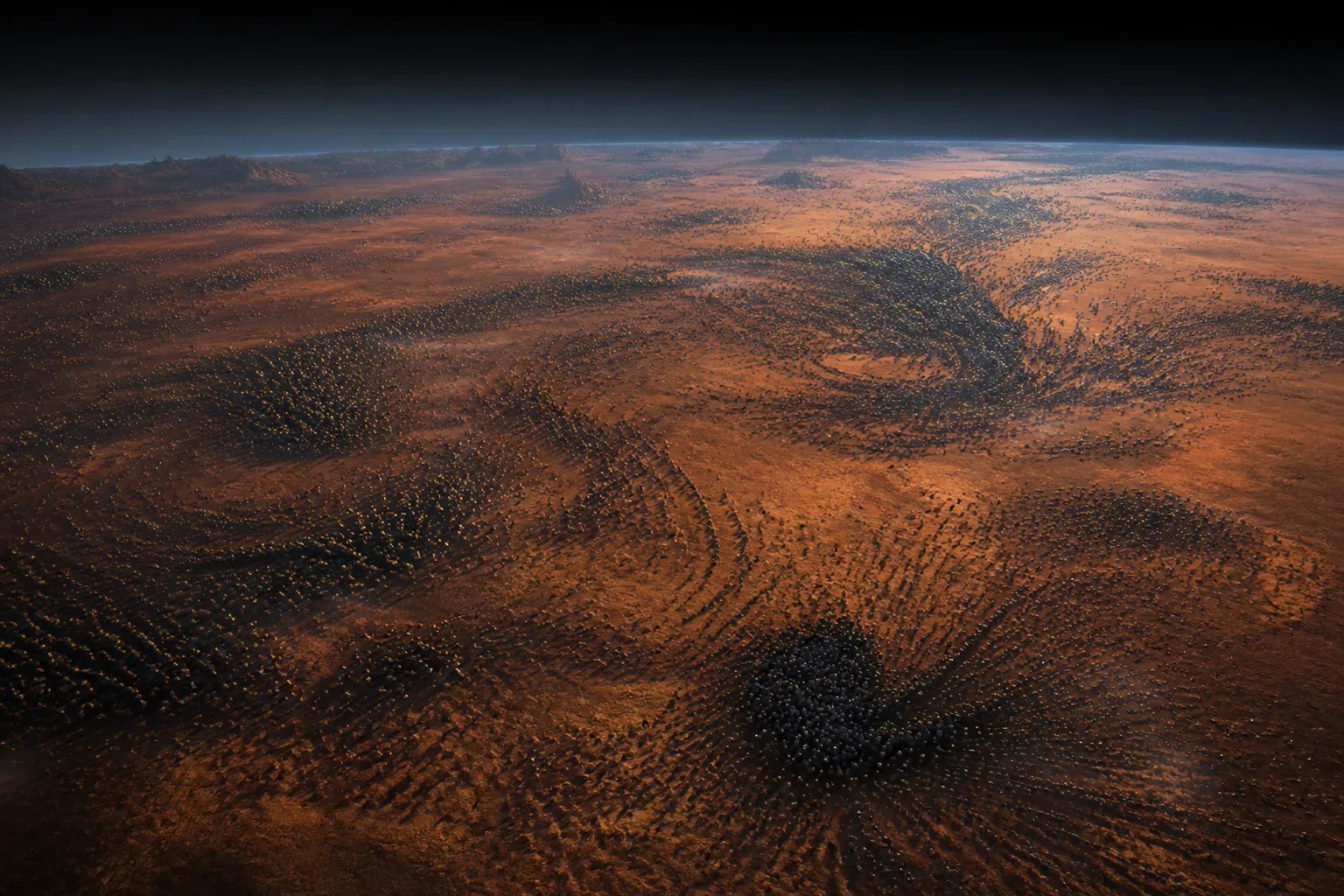Thousands of small dark nodes form vast waves and congestion patterns across a rust-coloured plain without a central node.